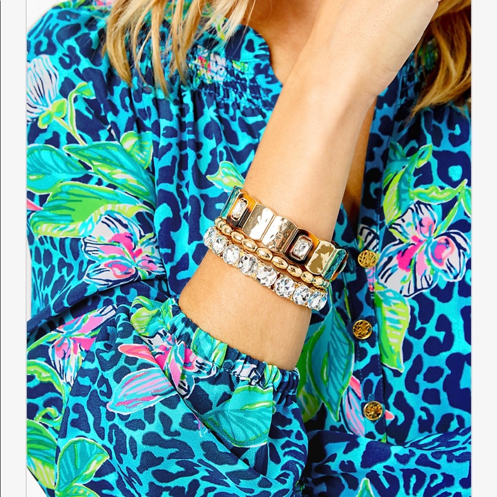 NWT and dust cover Strut your Stuff metallic gold